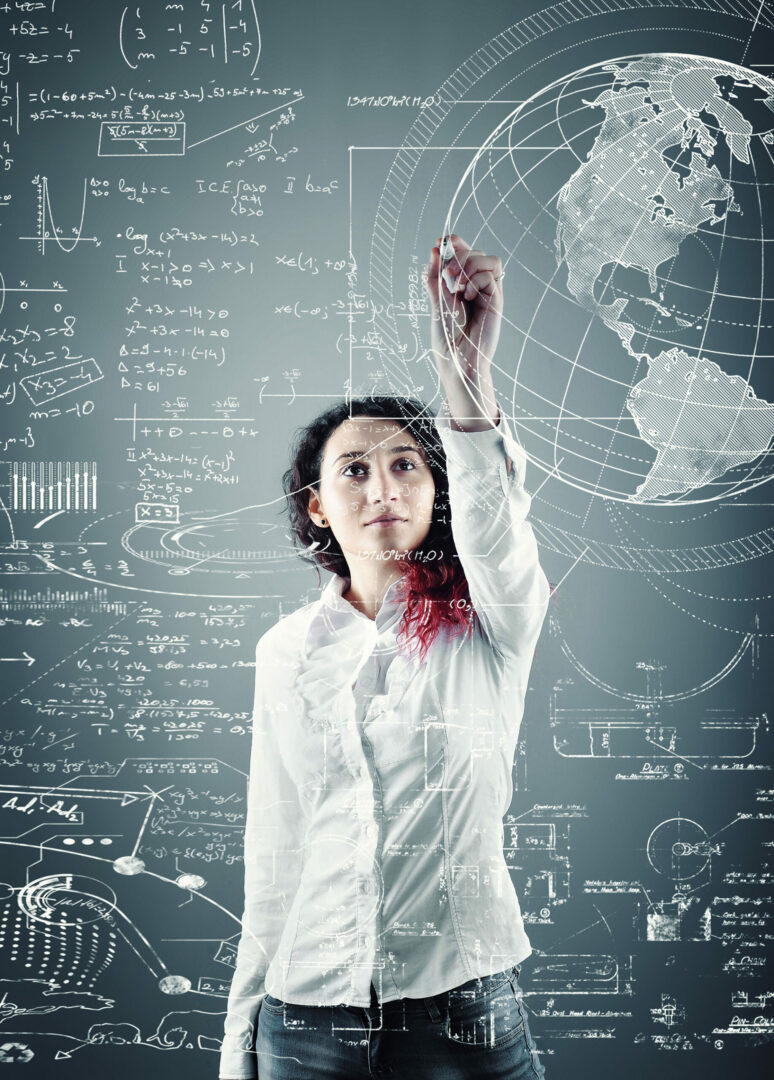 Young girl solving  math problems on blackboard